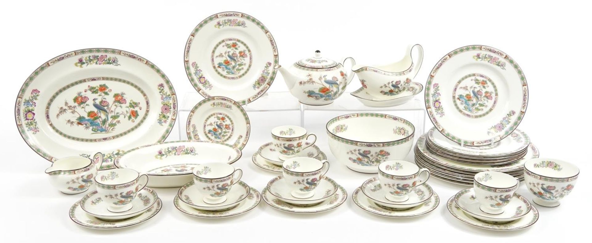 Wedgwood Kutani Crane dinner and teaware including teapot, plates, gravy boat on stand, cups with