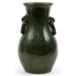 Large green glazed pot with ring turned handles, 45cm high