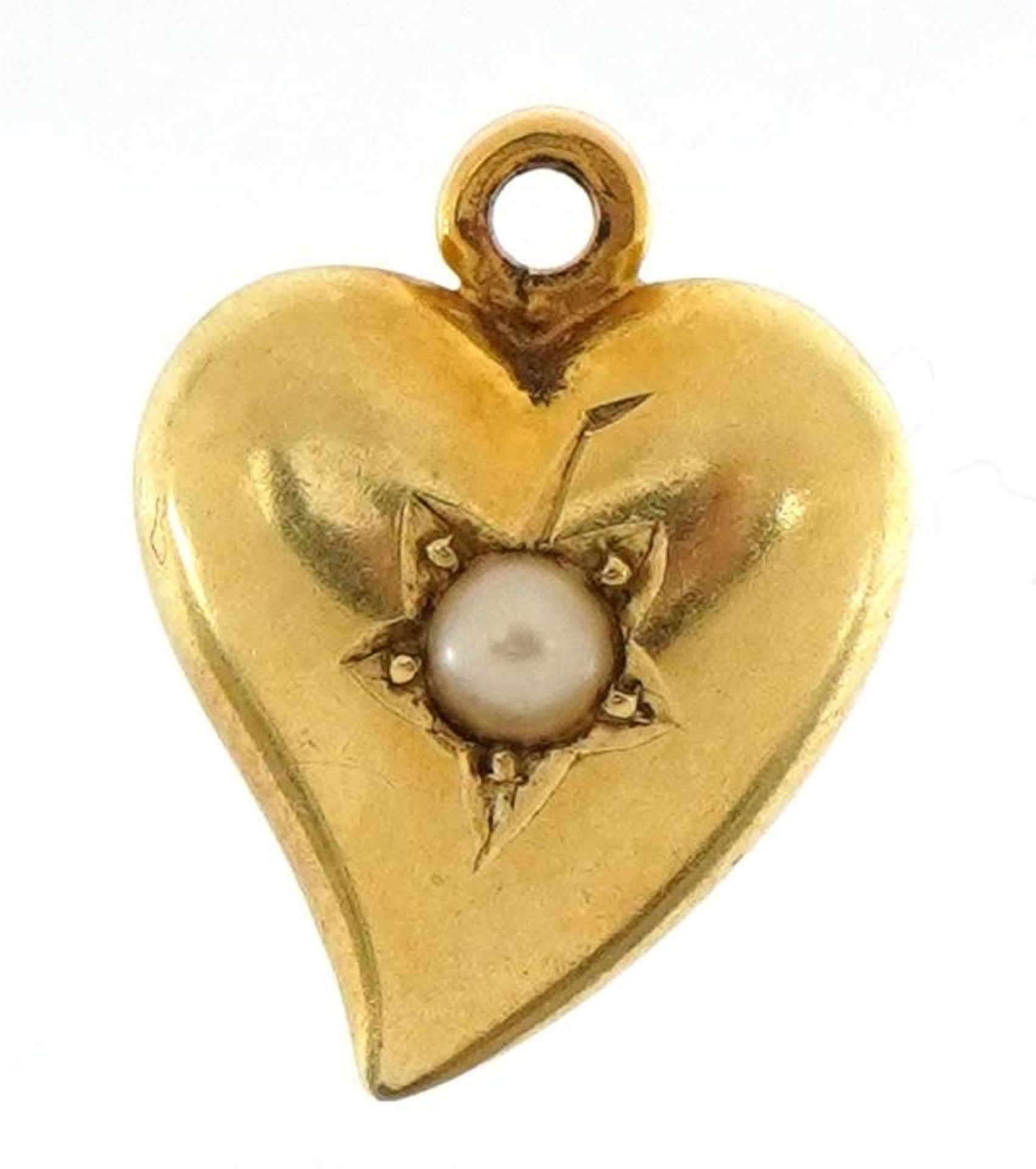 Antique unmarked gold love heart charm set with a seed pearl, locket panel to the reverse, 1.3cm