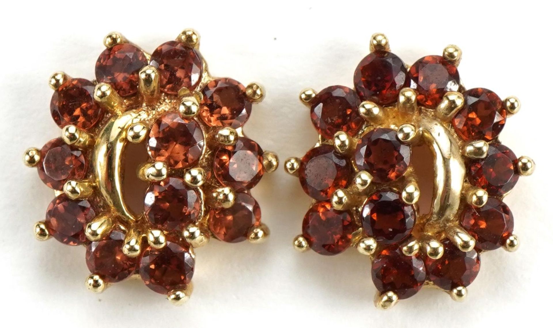 Pair of 9ct gold orange stone cluster stud earrings, 1.2cm high, 2.6g