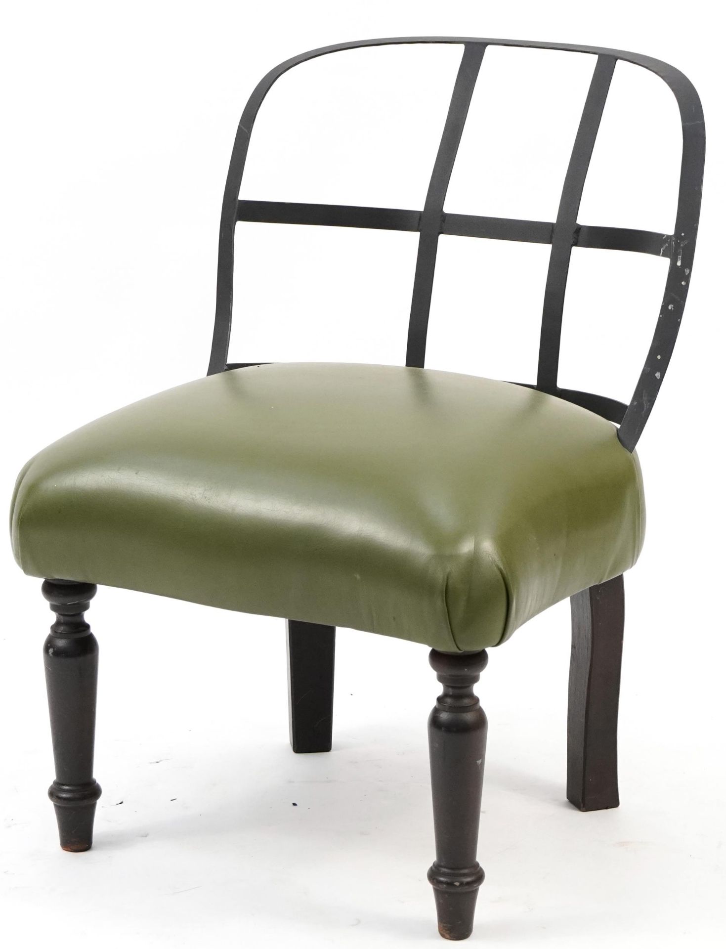 Industrial style wrought iron chair with green leather upholstered seat on turned mahogany legs,