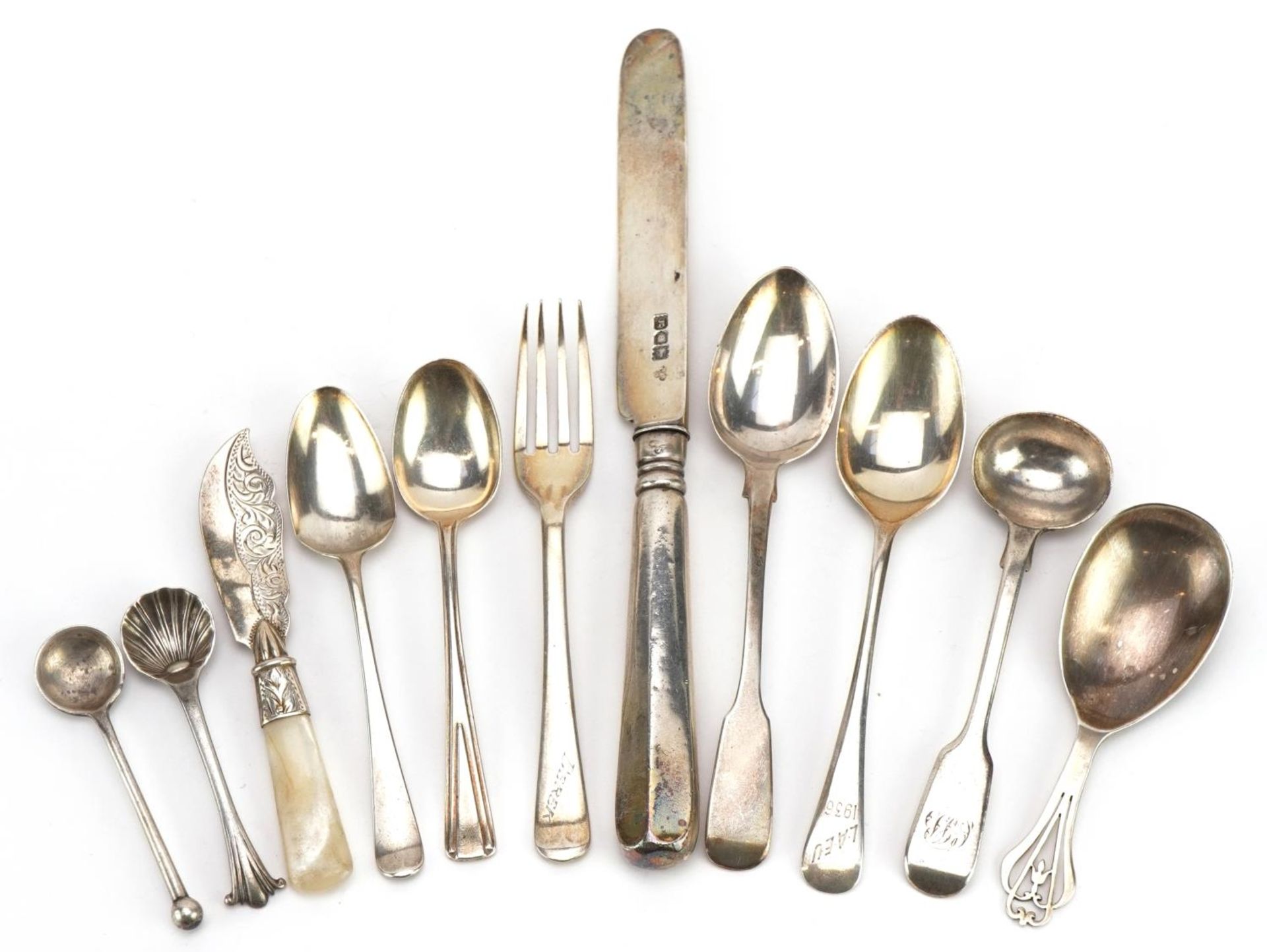 Georgian and later silver cutlery including caddy spoon, mustard spoons and teaspoons, the largest