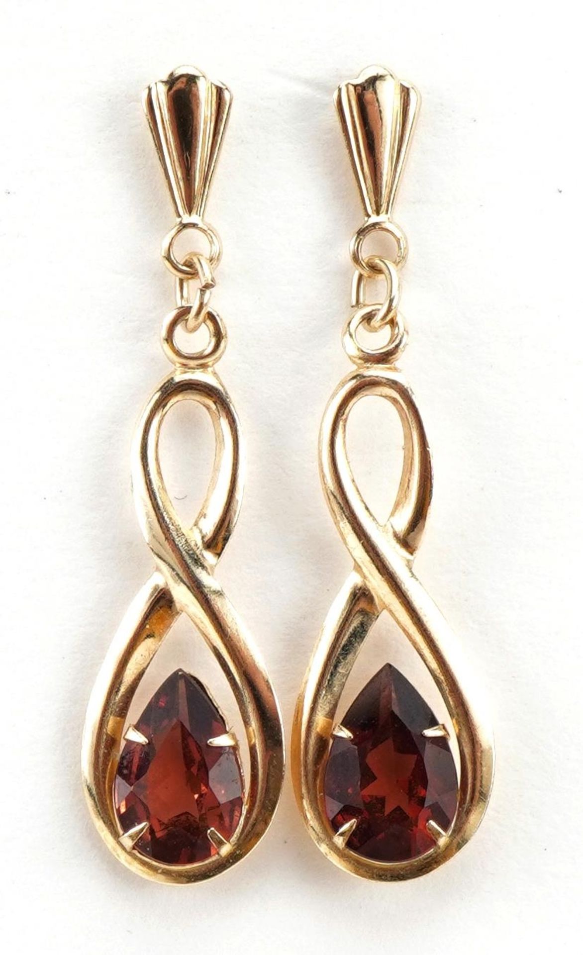 Pair of 9ct gold garnet infinity drop earrings, 2.5cm high, 0.6g