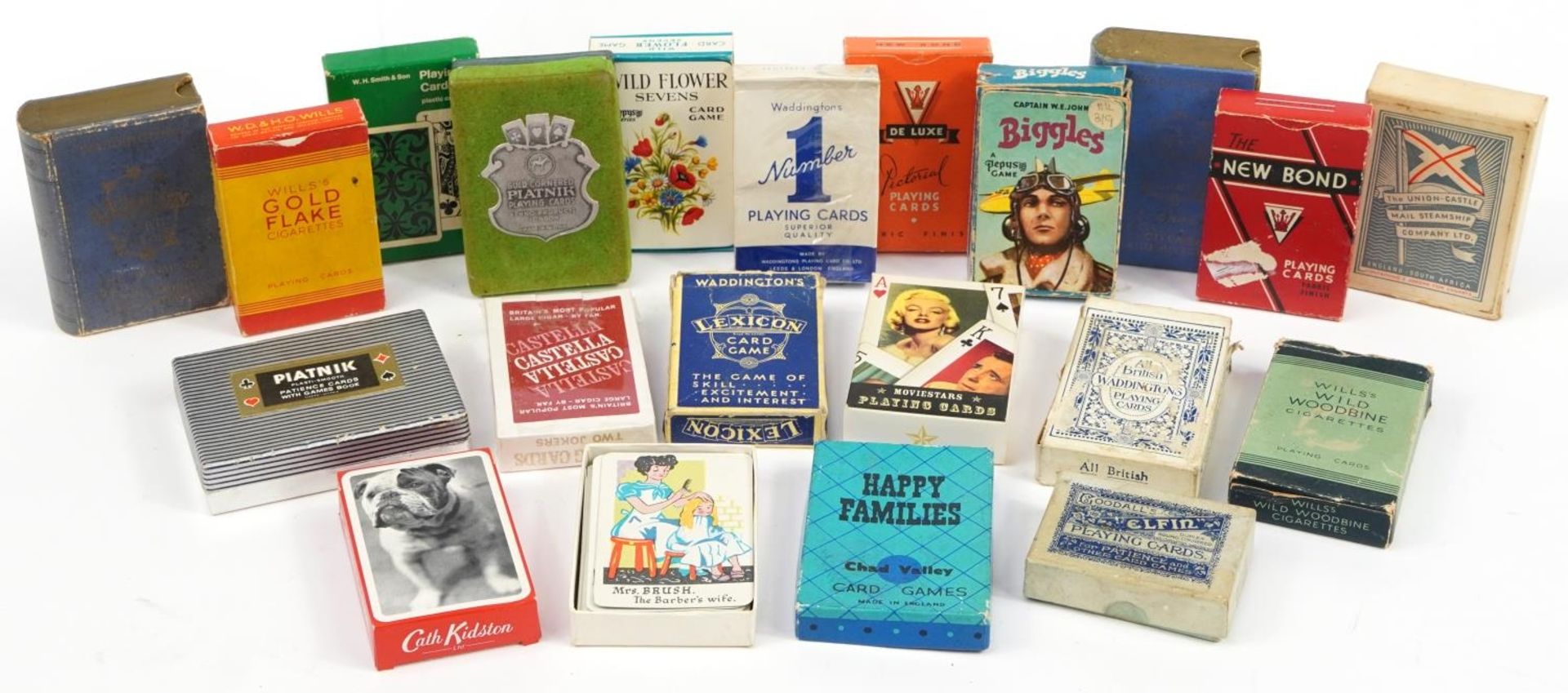 Twenty packets of vintage and later playing cards, some sealed, including Lexicon, Biggles and The