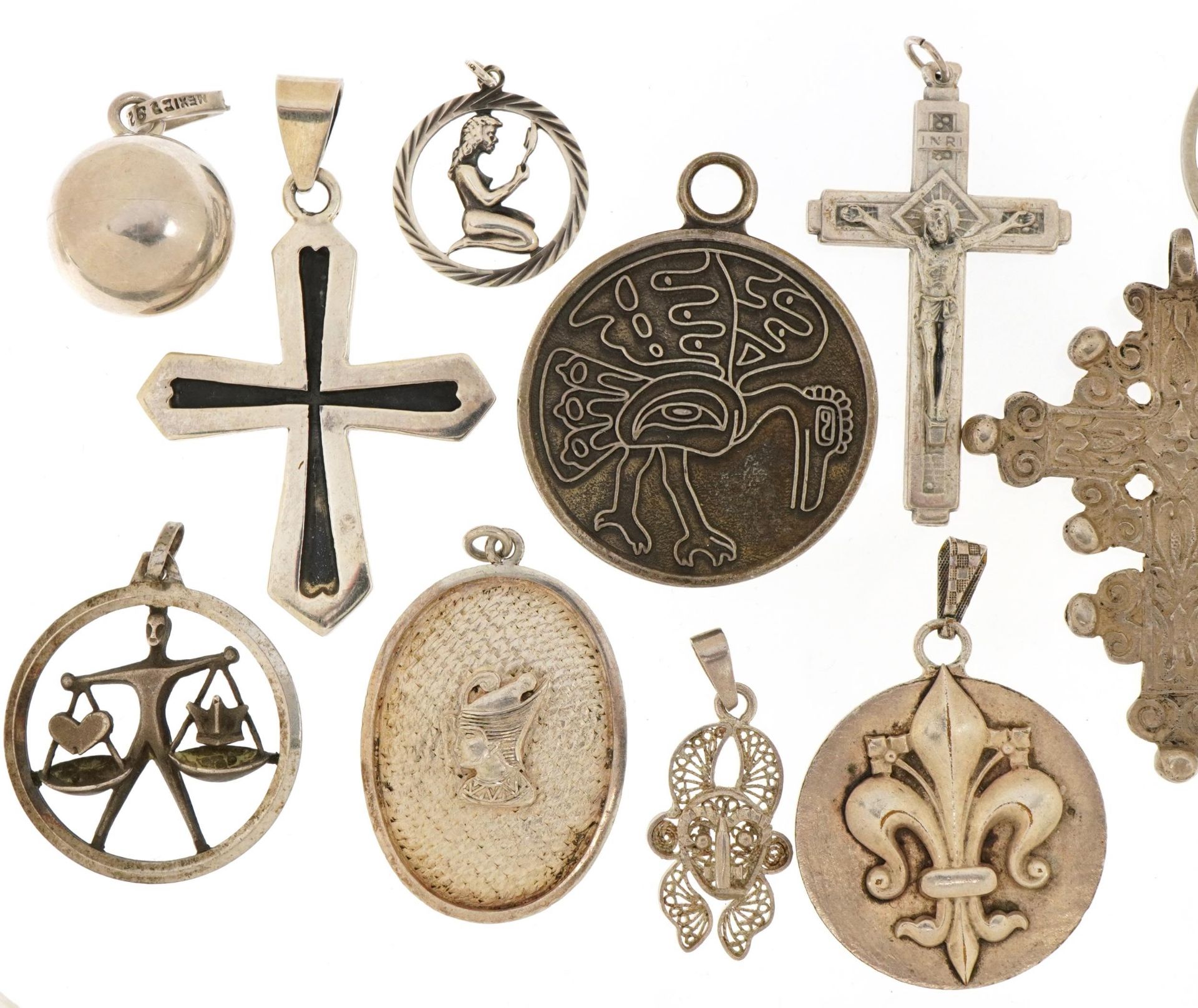 Silver and white metal pendants including Rococo style cross, Nefertiti and fleur de lis Joan of - Image 2 of 5