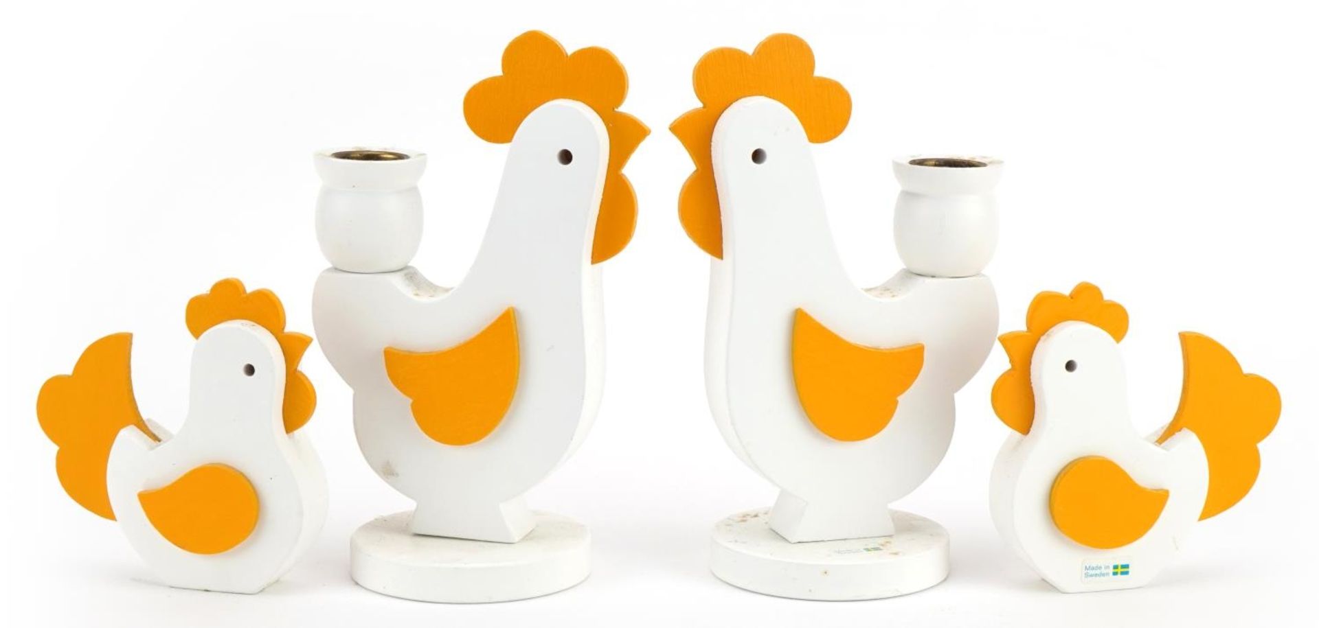 Two pairs of Swedish wooden chickens including a pair of candlesticks, the largest each 17.5cm high