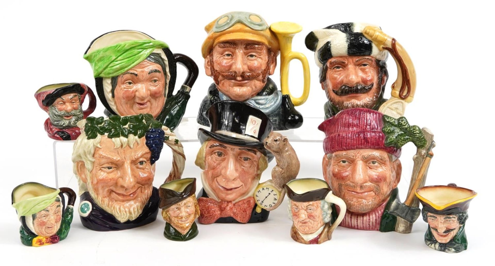 Six large and five small Royal Doulton Toby jugs including Sairey Gamp D5451, Lumberjack D6610,