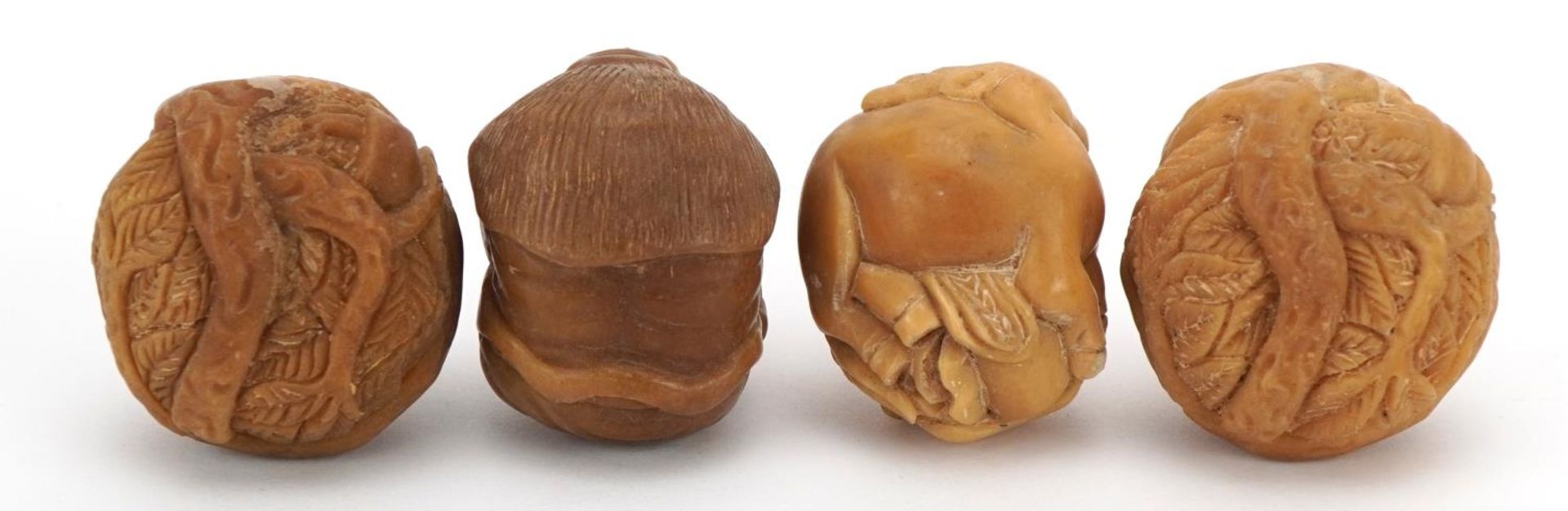 Four Japanese carved nut netsukes of animals and elders, the largest 3.5cm wide - Image 2 of 3