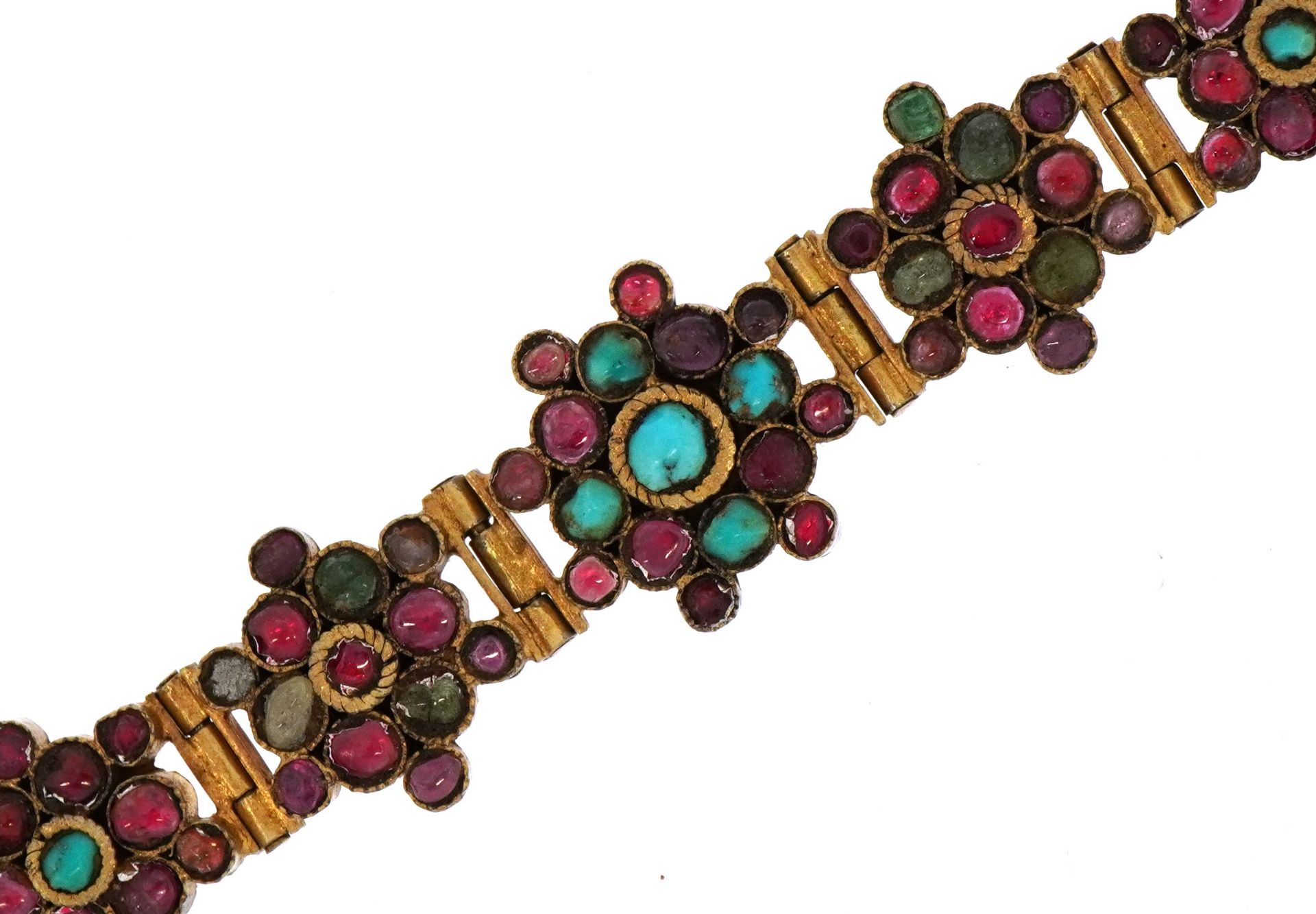 Continental gilt metal flower head multigem bracelet, set with colouful stones including rubies,