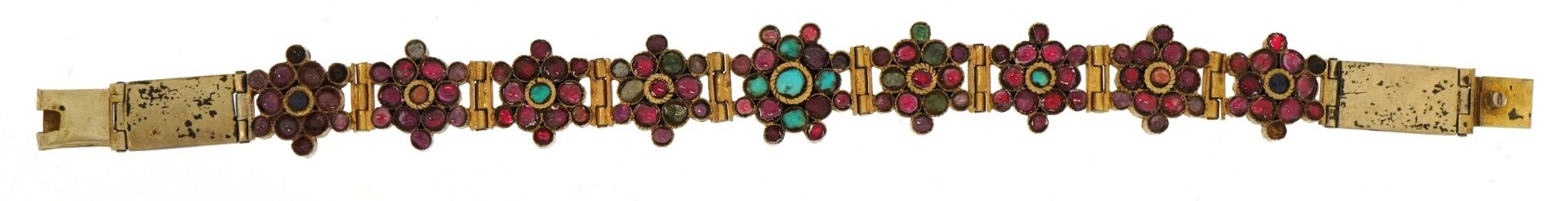 Continental gilt metal flower head multigem bracelet, set with colouful stones including rubies, - Image 2 of 3