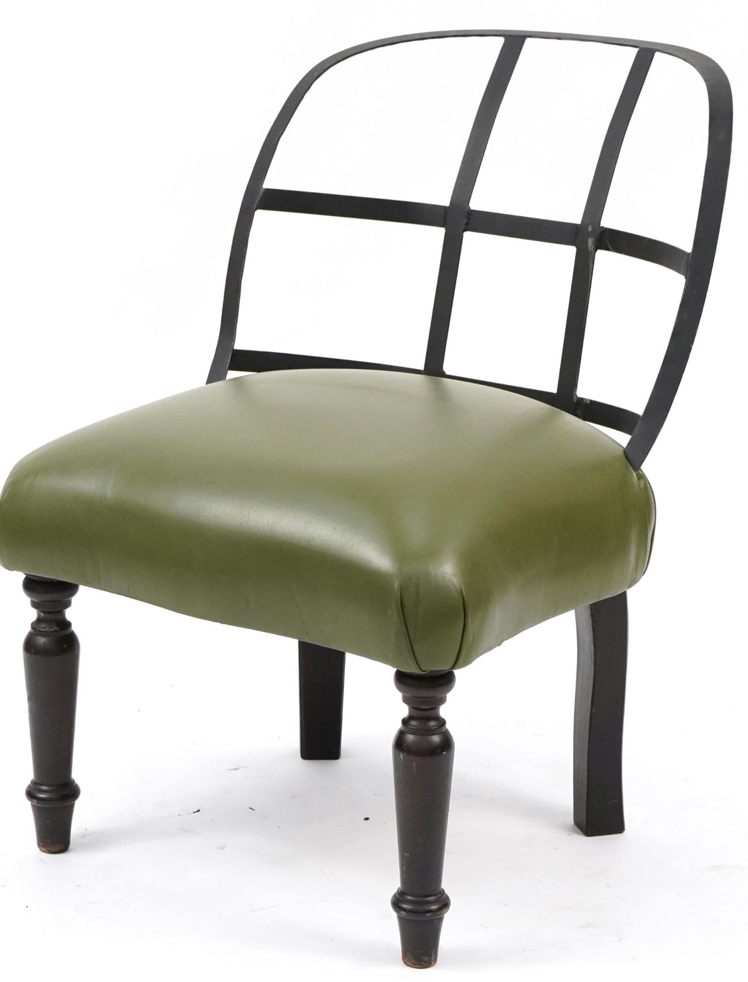 Industrial style wrought iron chair with green leather upholstered seat on turned mahogany legs,