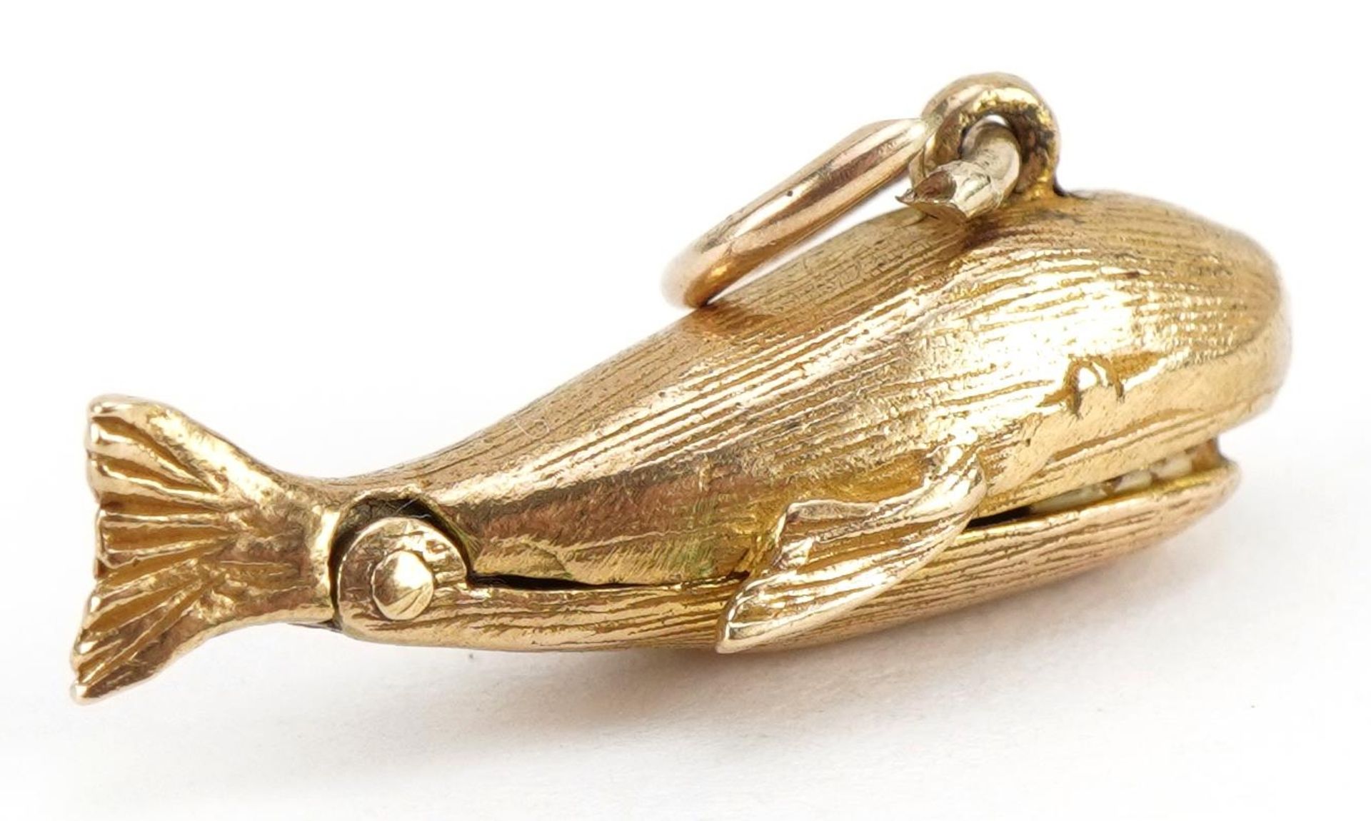 9ct gold whale charm with hinged mouth opening to reveal an enamelled figure, 2.3cm wide, 2.7g - Image 2 of 4