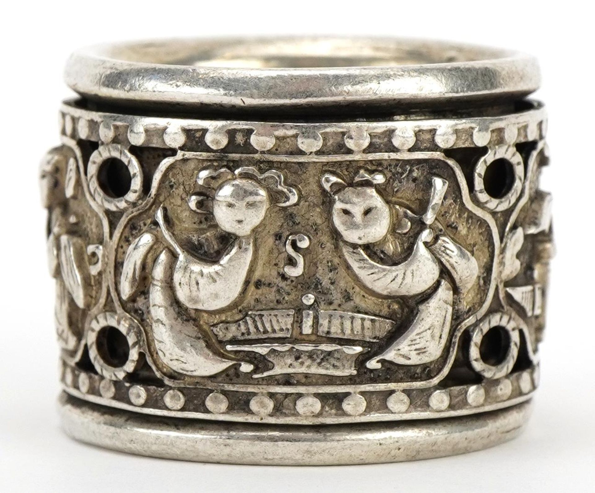 Chinese silver coloured metal archer's ring decorated with figures, 3cm in diameter