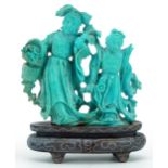 Chinese turquoise carving of two females raised on a hardwood stand with white metal inlay, 11cm