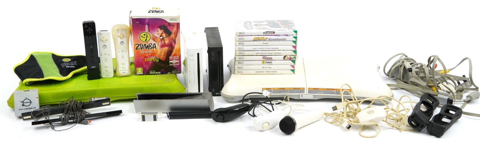 Two Nintendo Wii games consoles with controllers, collection of games and two Wii fit balance boards