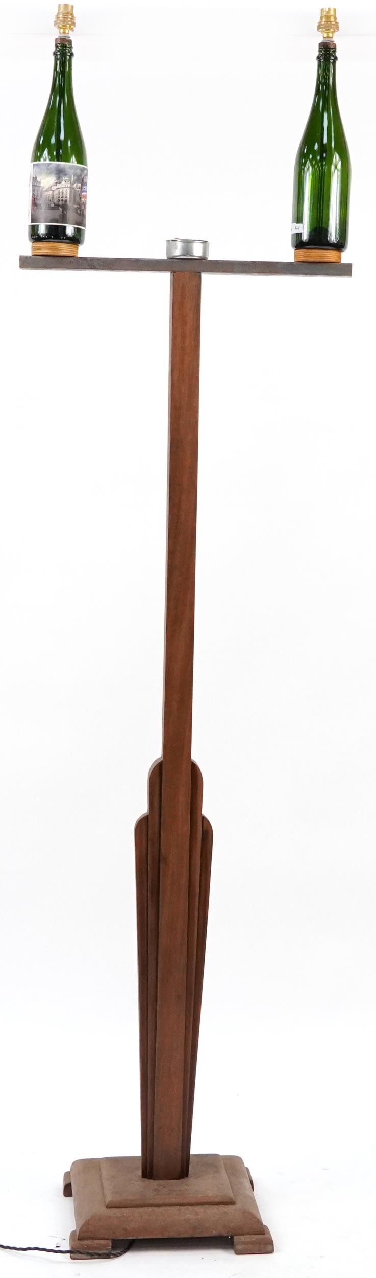 Carved oak and champagne bottle standard lamp, 190cm high