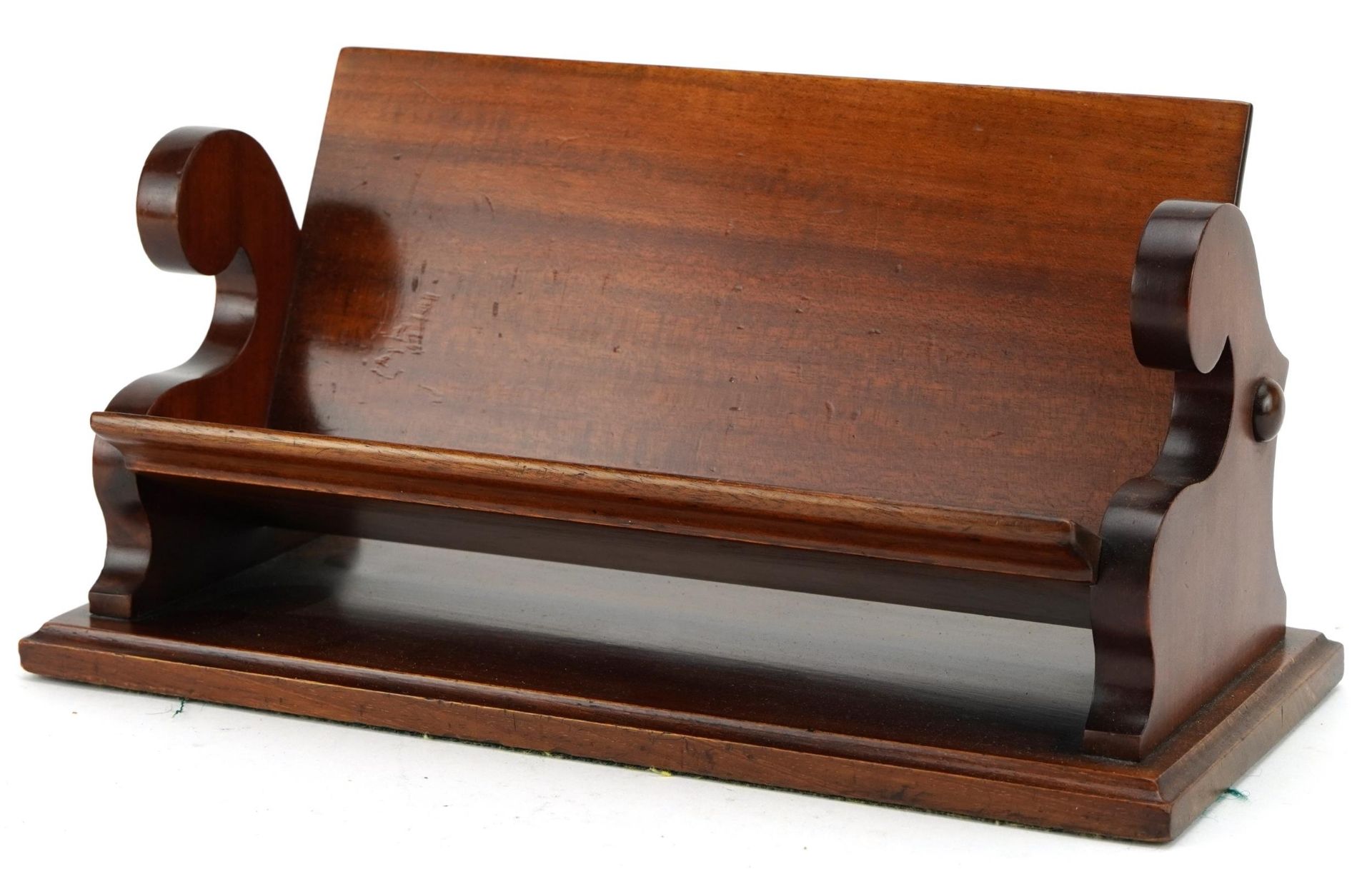 Victorian mahogany bookrest in the form of a bench, 30.5cm wide