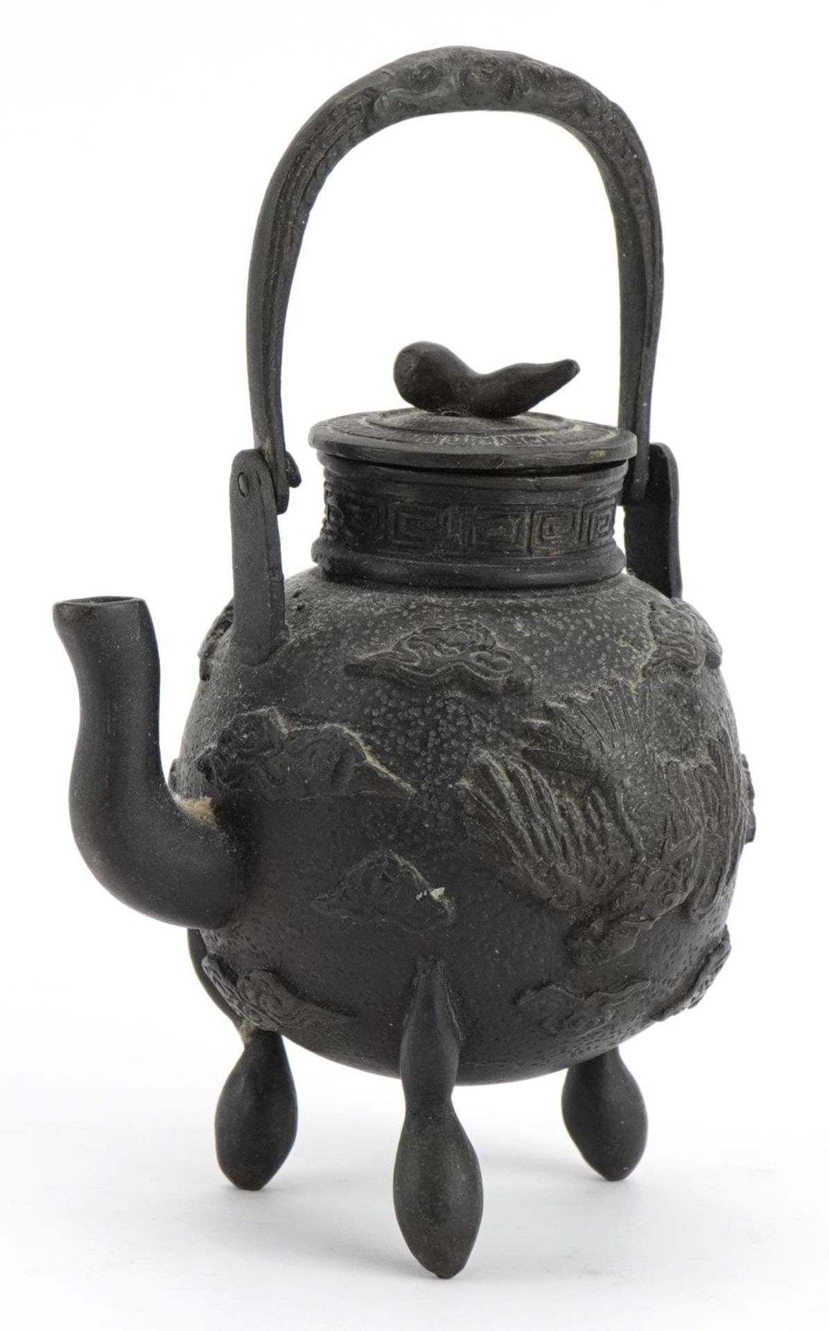 Miniature Asian three footed patinated bronze teapot cast with phoenixes amongst clouds, Chinese