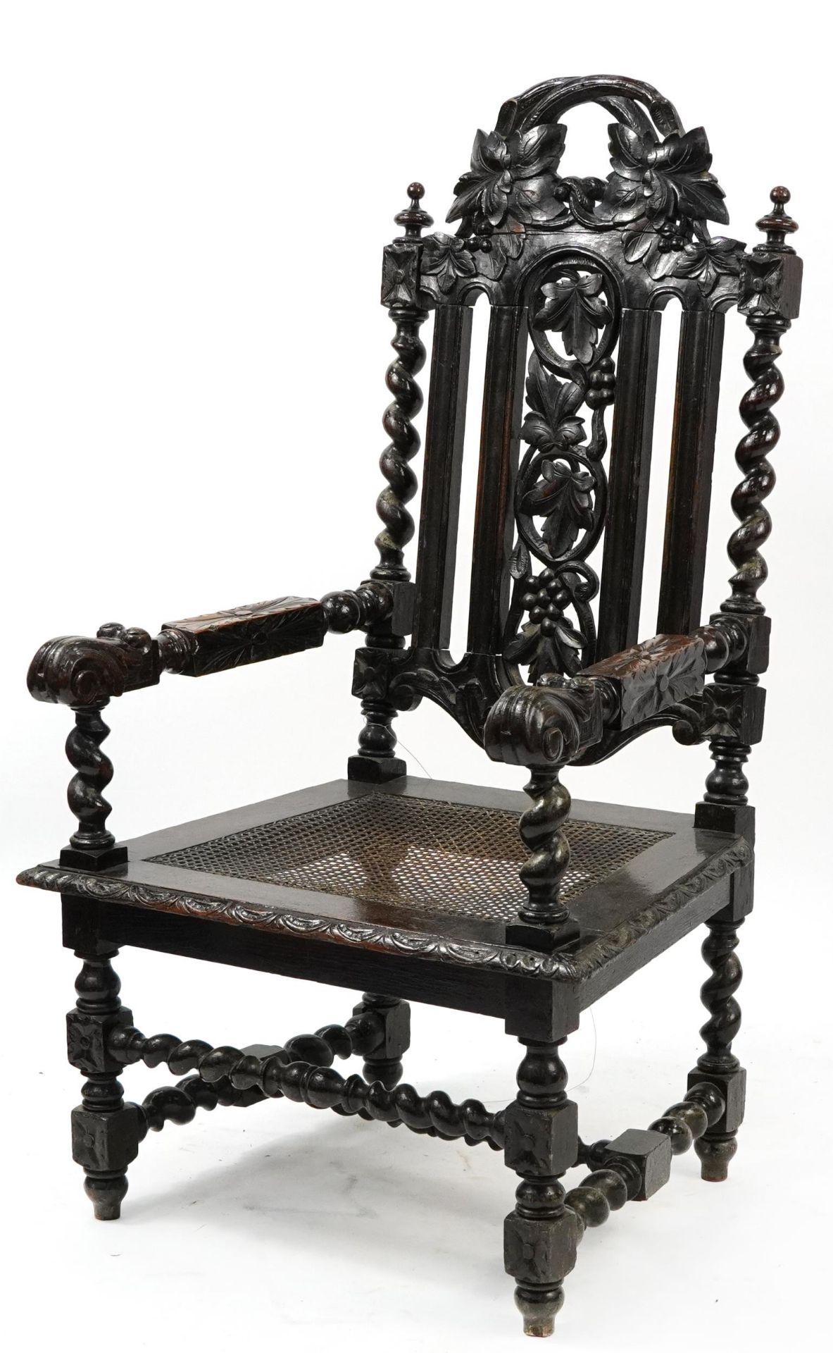 Antique barley twist oak chair carved with grapevine and cane bergere seat, 130cm high