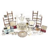 Silver plate including circular four footed salver, souvenir teaspoons on display stands, cruets,