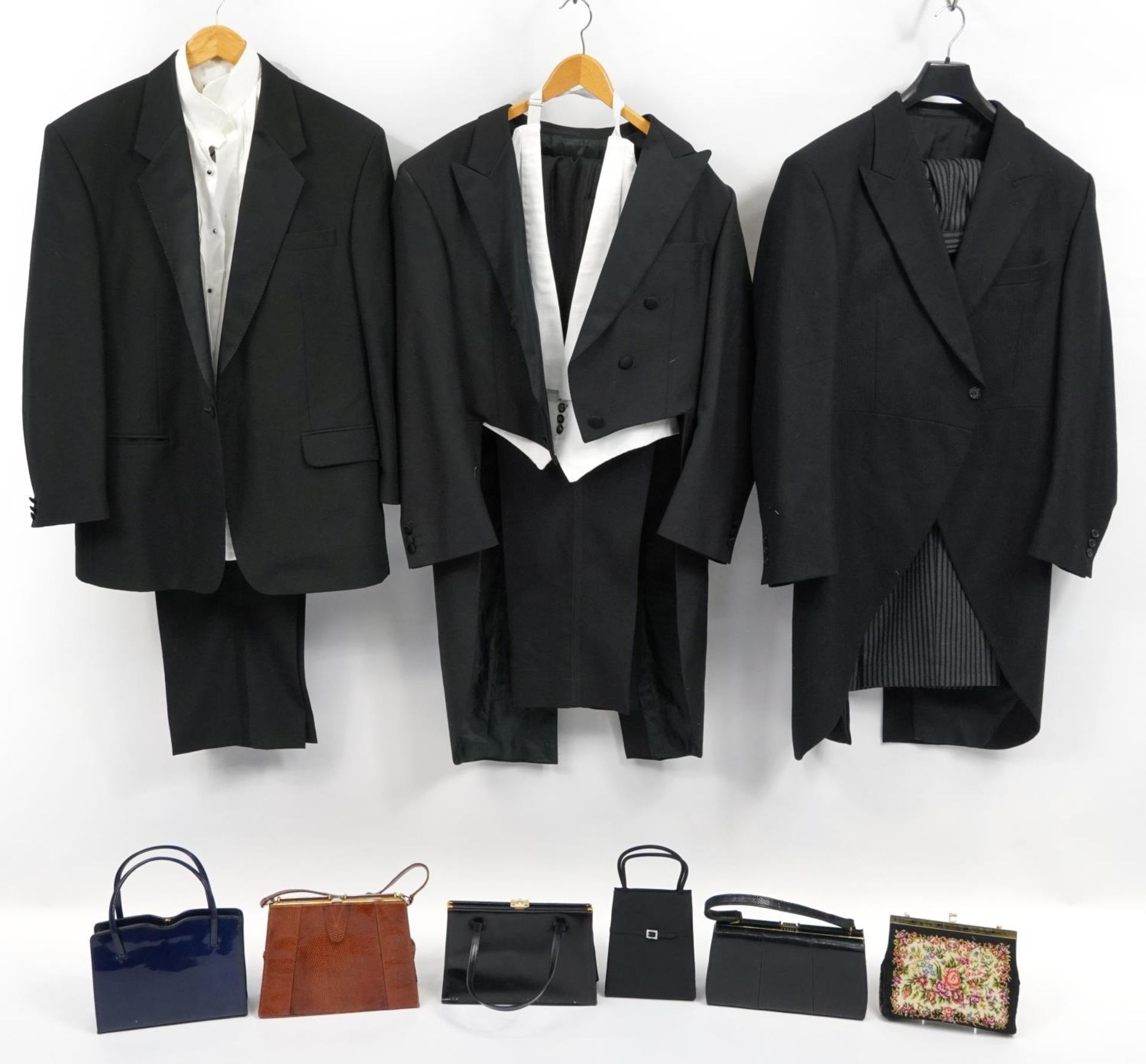 Three gentlemen's tailored suits including Van Heusen and six ladies handbags including two lizard