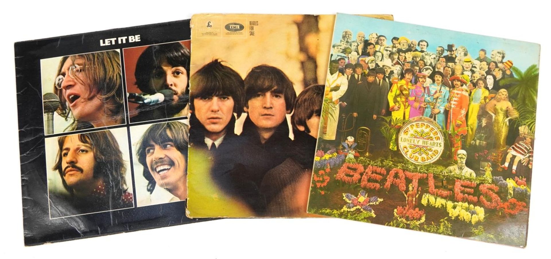 Three Beatles vinyl LP records including Sgt Pepper's Lonley Hearts Club Band with cut out and