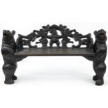 Swiss Black Forest carved bear bench with two standing bears holding a carved backrest decorated