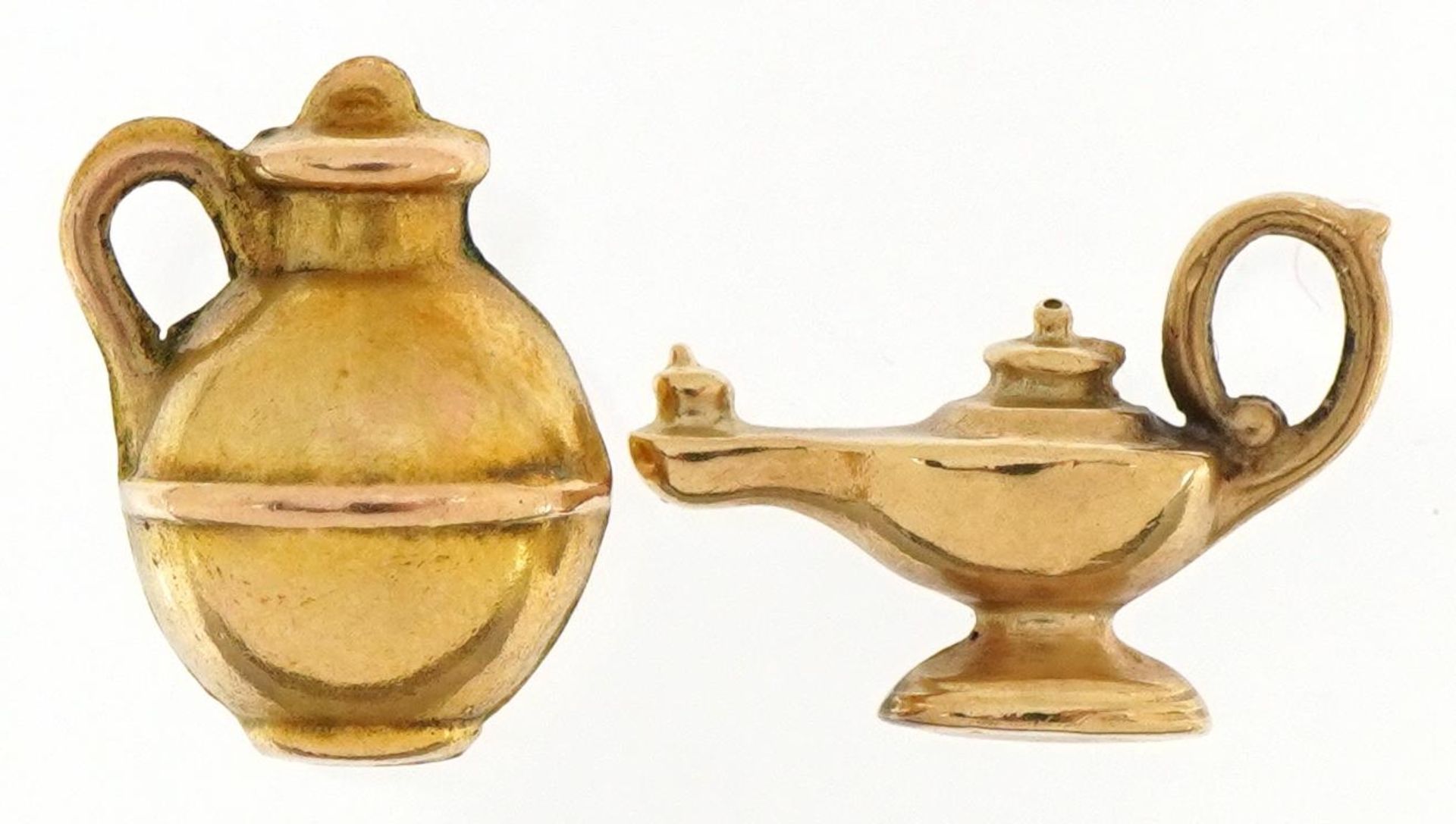 Two 9ct gold charms comprising oil lamp and vessel, the largest 1.6cm high, total 1.2g