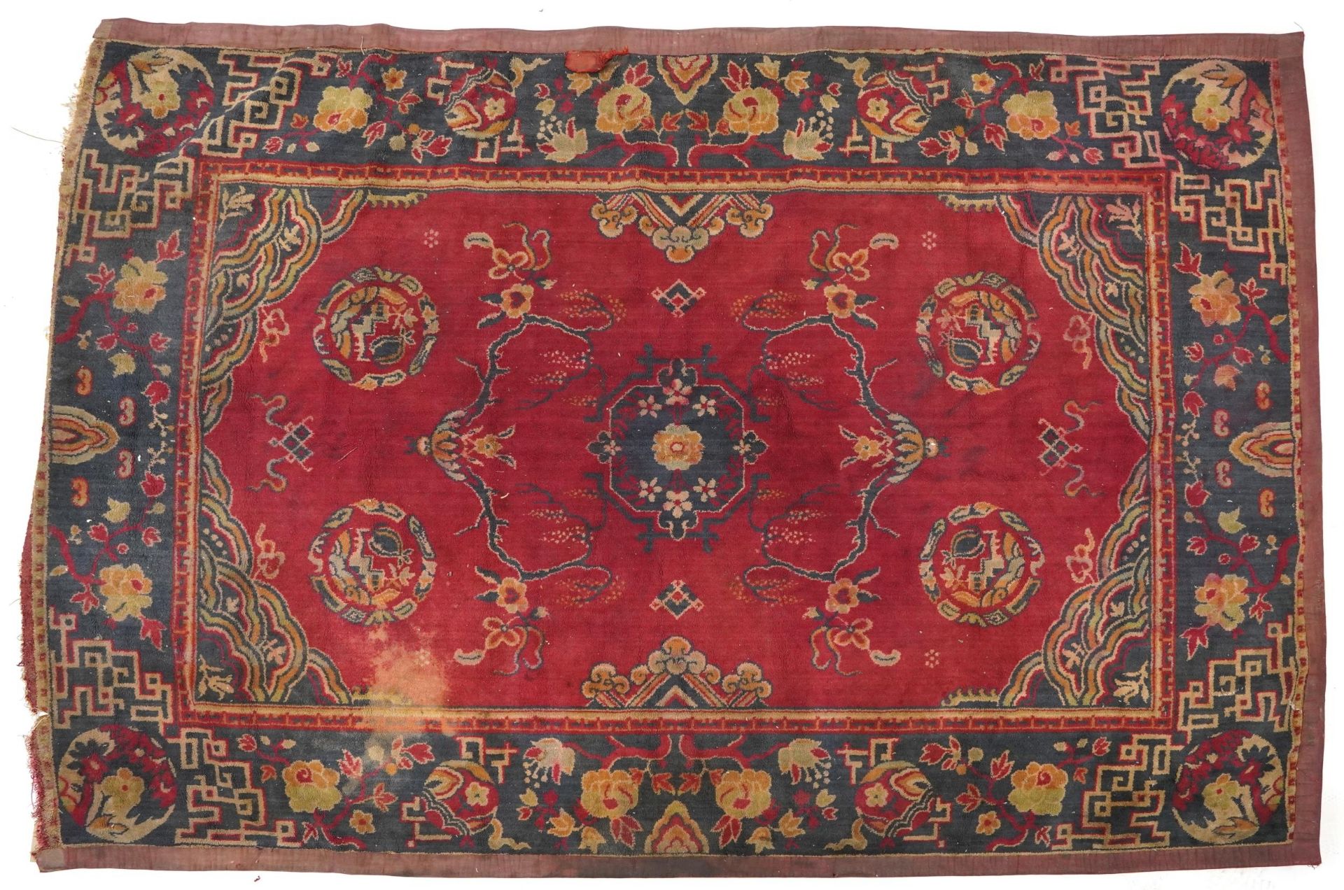 Rectangular Chinese red and blue ground rug having an all over floral design, 192cm x 134cm
