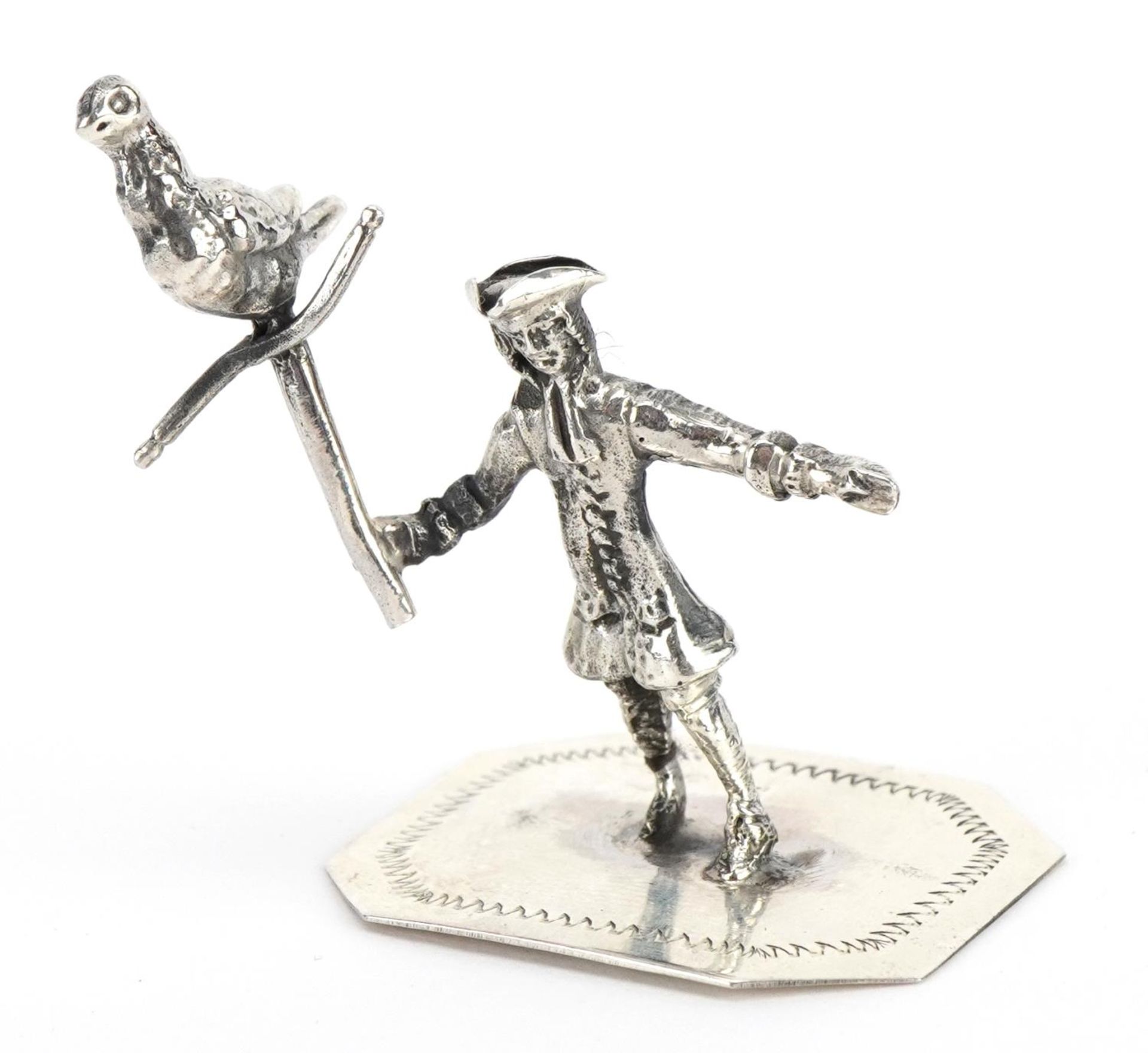 Miniature sterling silver figure of a gentleman holding a bird on a perch, 4cm high, 13.5g