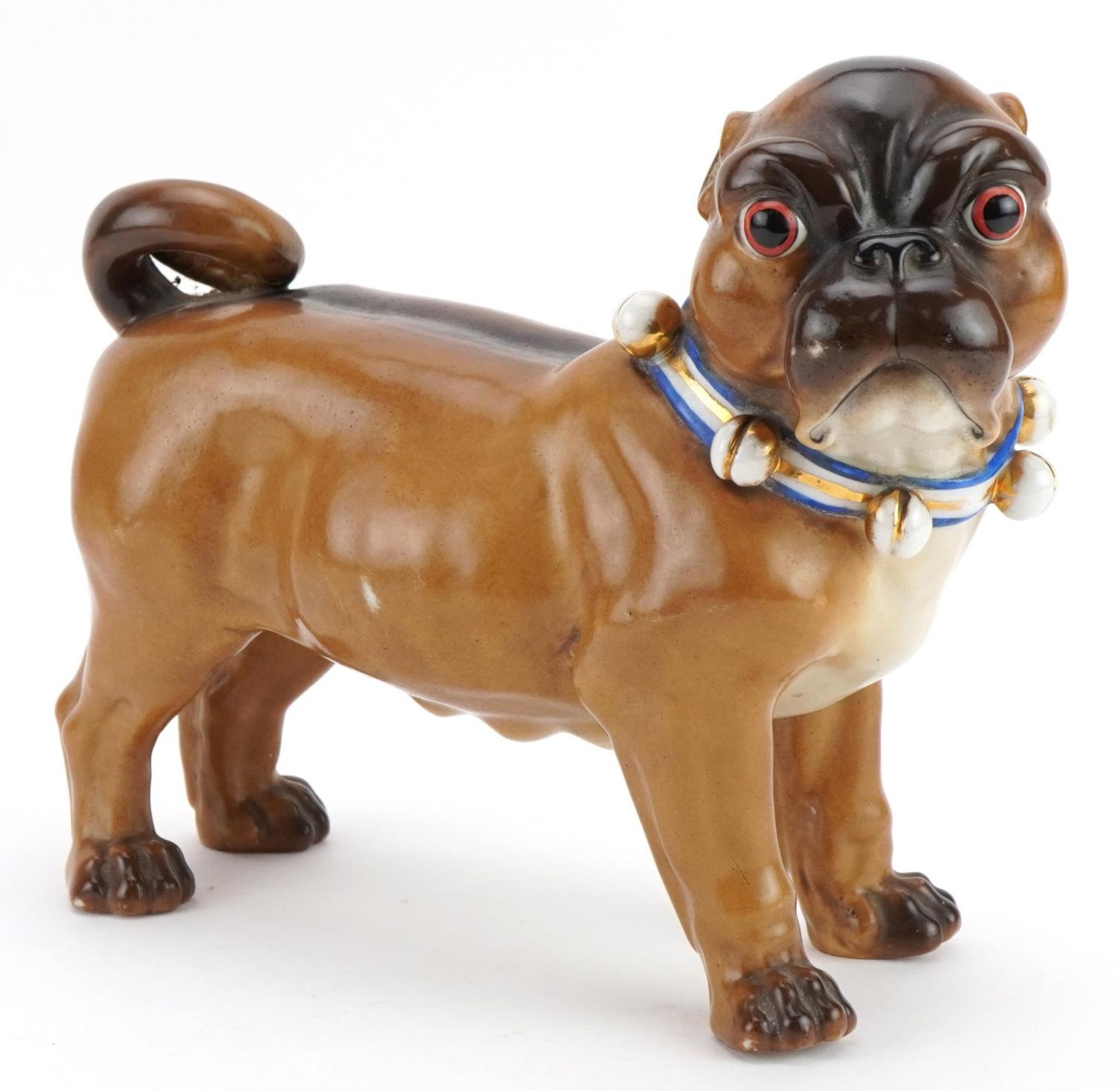 19th century continental porcelain model of a Pug dog, impressed marks and numbers to the feet, 24cm