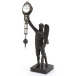 Patinated bronze military interest mystery clock in the form of a pilot, 38cm high