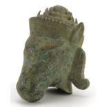 Chino Tibetan patinated bronze head of a mythical animal, 16.5cm high