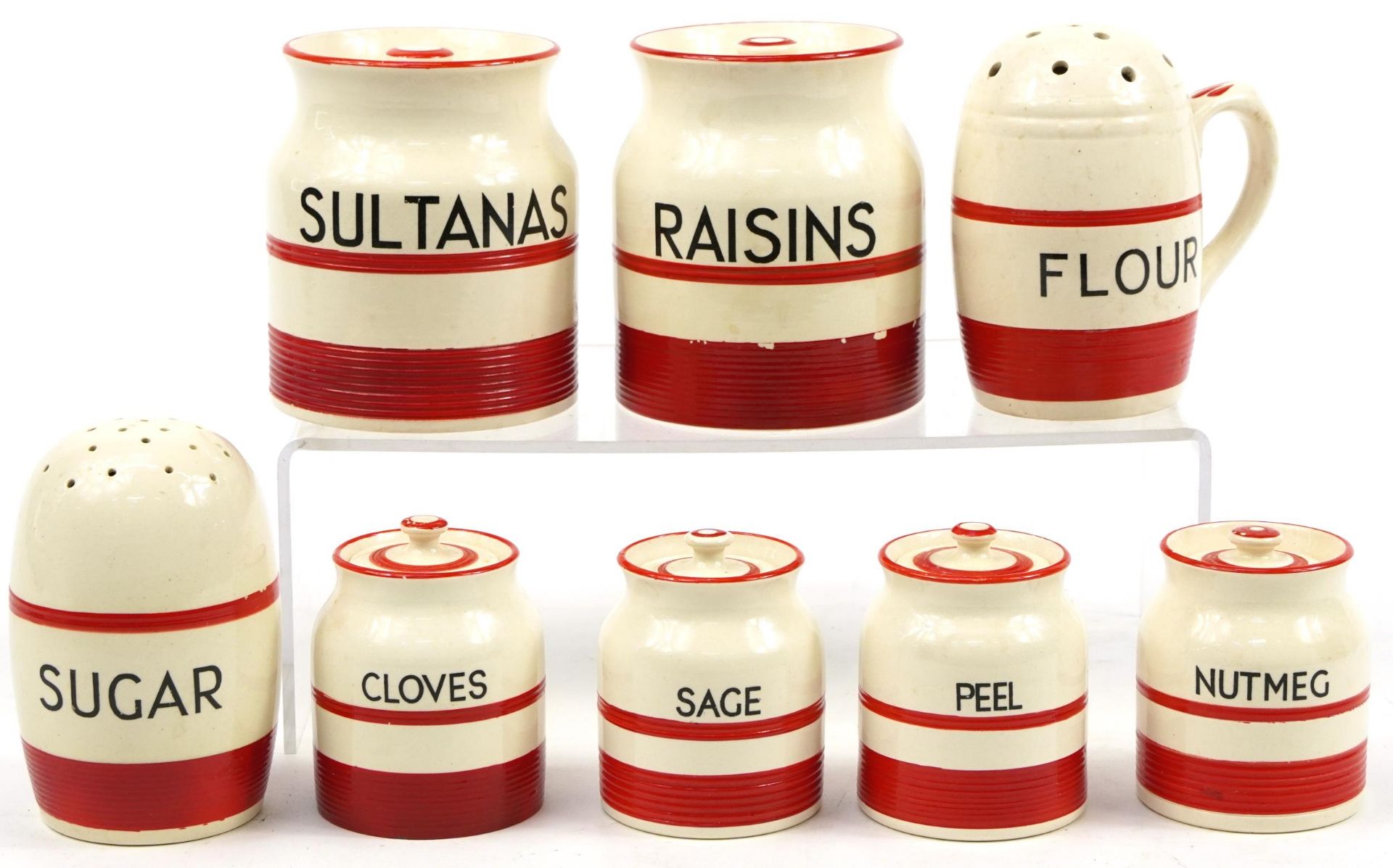 Eight vintage Kleen Kitchenware storage jars and sifters, the largest 12cm high