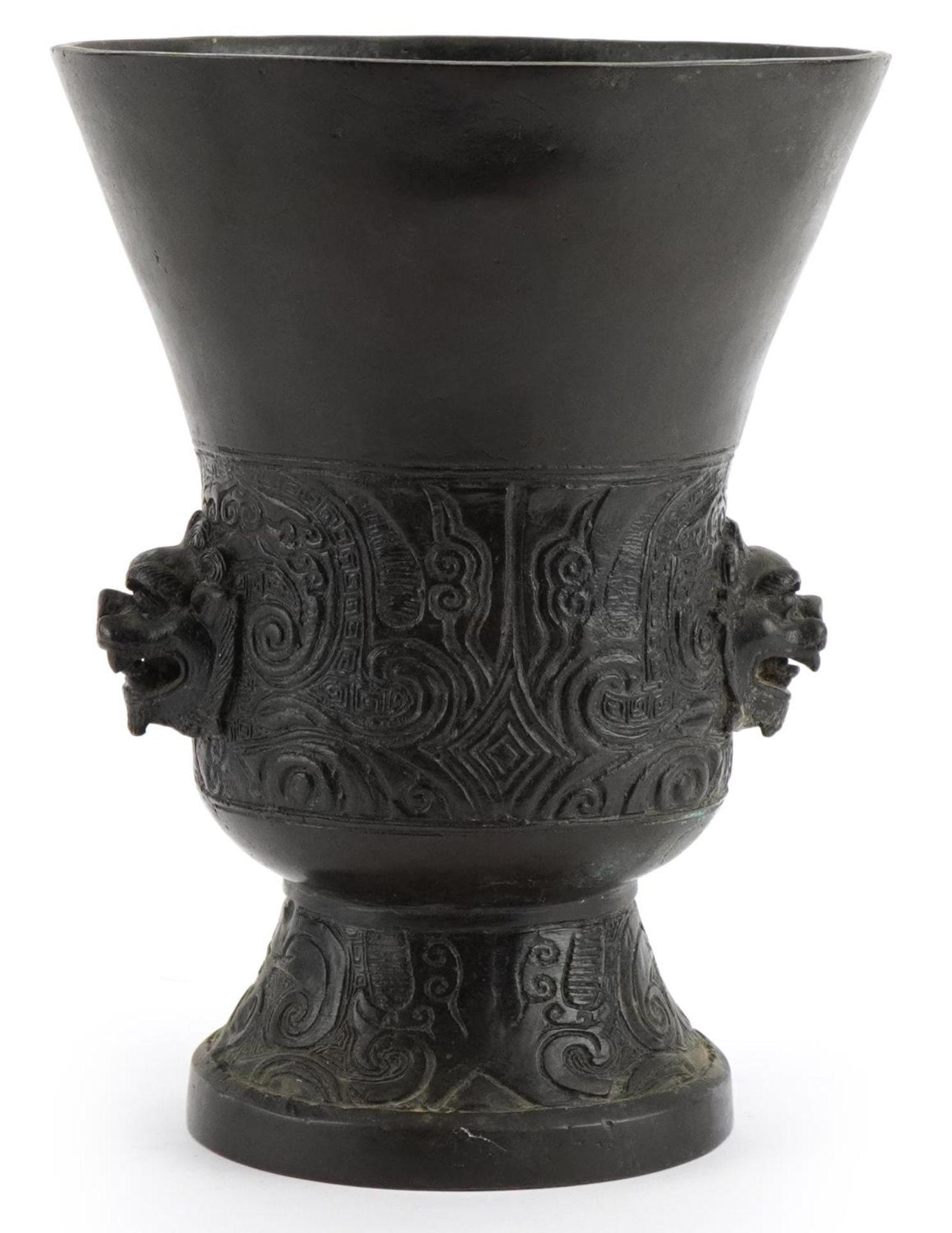 Chinese patinated bronze archaic style vessel with mythical head handles, 21cm high