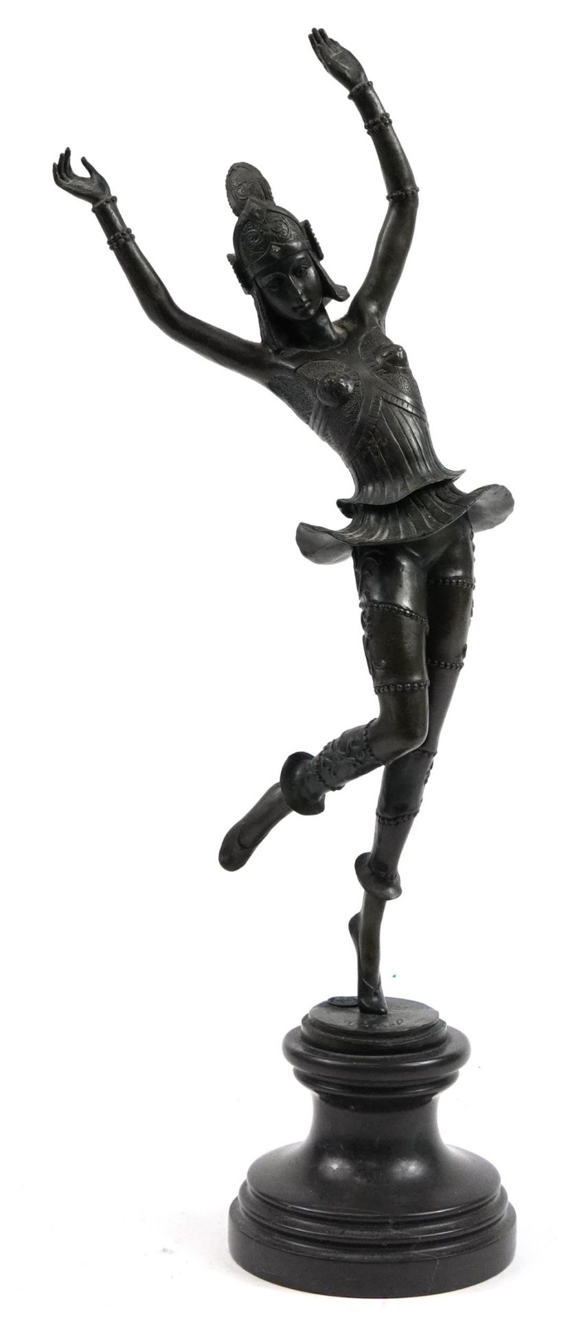 Patinated bronze figurine of an Art Deco dancer raised on a circular black marble base, 55.5cm high