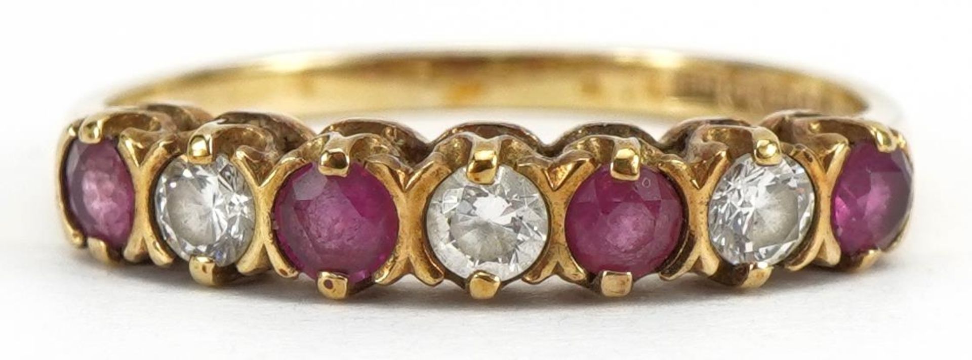 9ct gold ruby and clear stone half eternity ring, London 1987, size L, 1.5g