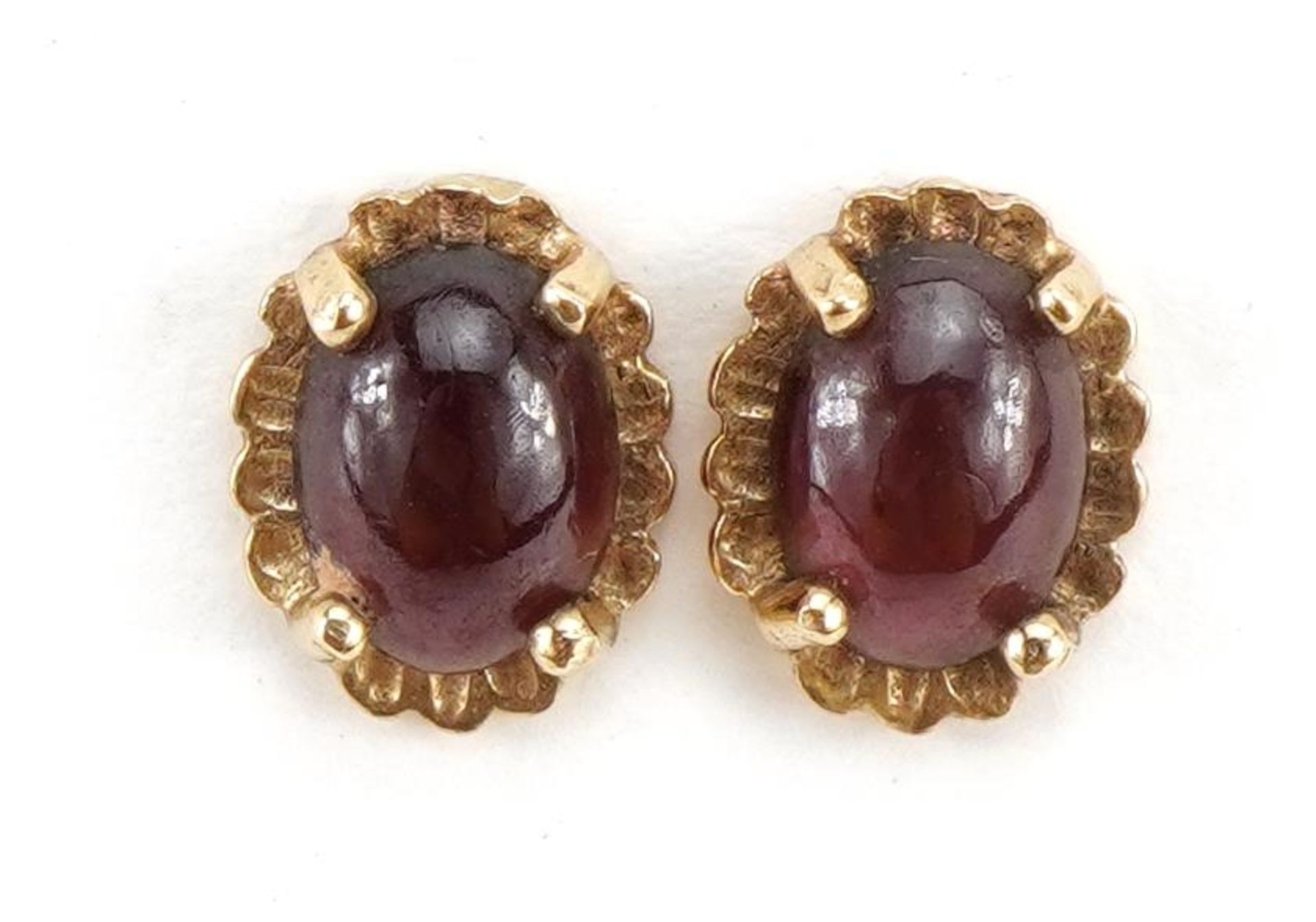Pair of 9ct gold cabochon garnet stud earrings, 9.1cm high, 1.2g