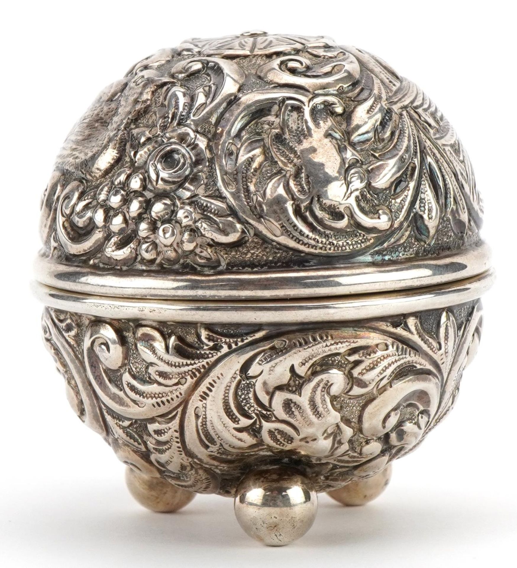 William Comyns, Victorian silver string box embossed with birds amongst foliage raised on three ball - Image 2 of 4