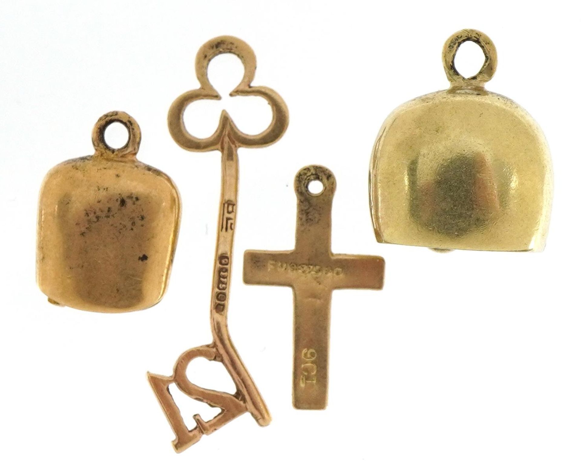 Four 9ct gold charms including bell with enamelled flower, '21' key and cross, the largest 2.5cm - Image 2 of 3