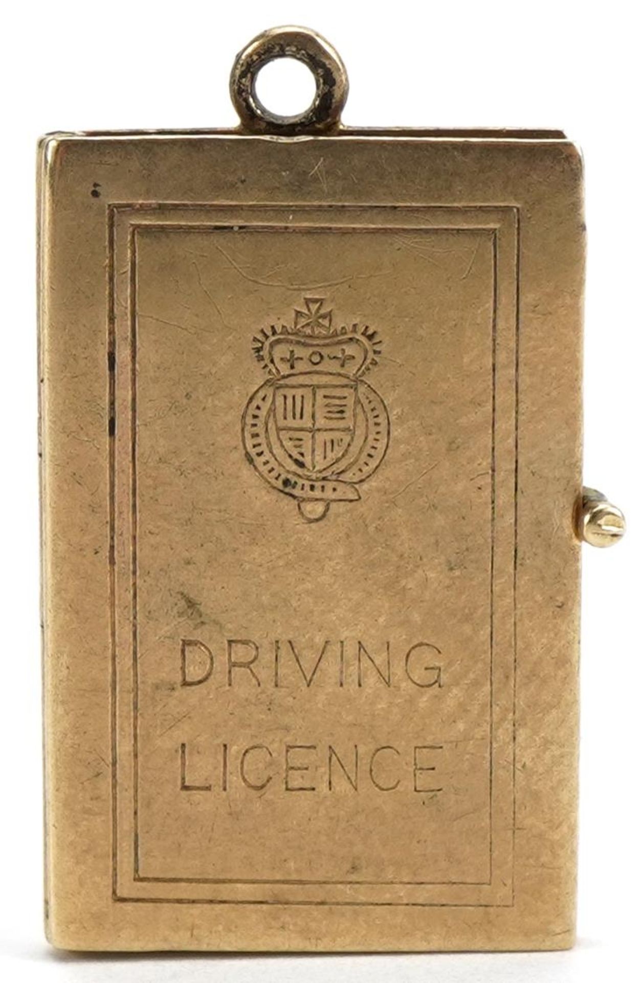 9ct gold opening driving licence charm, 2.1cm high, 2.4g