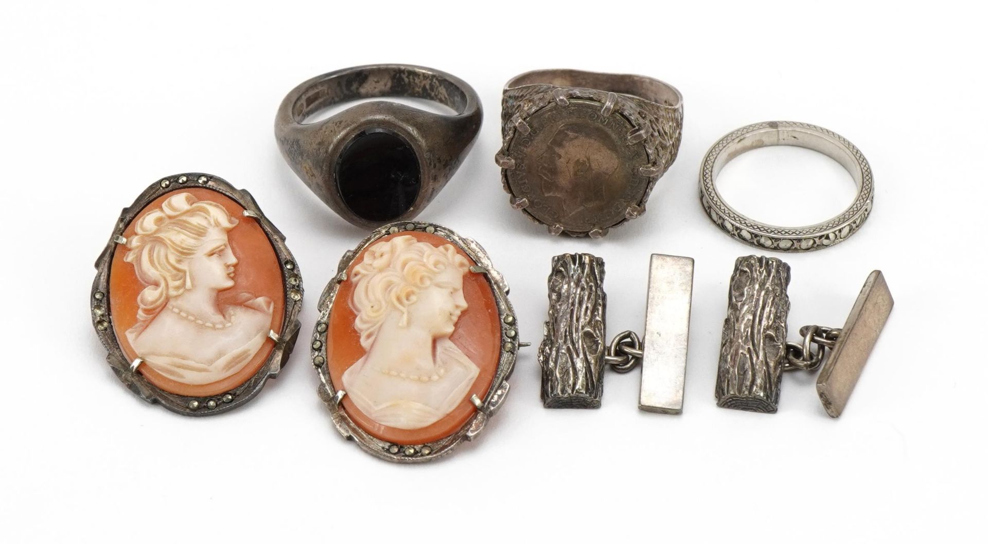 Antique and later silver jewellery including black onyx signet ring, bark design cufflinks,