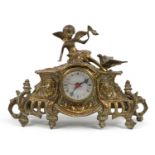 French design gilt brass mantle clock mounted with a winged figure and bird, 35cm wide