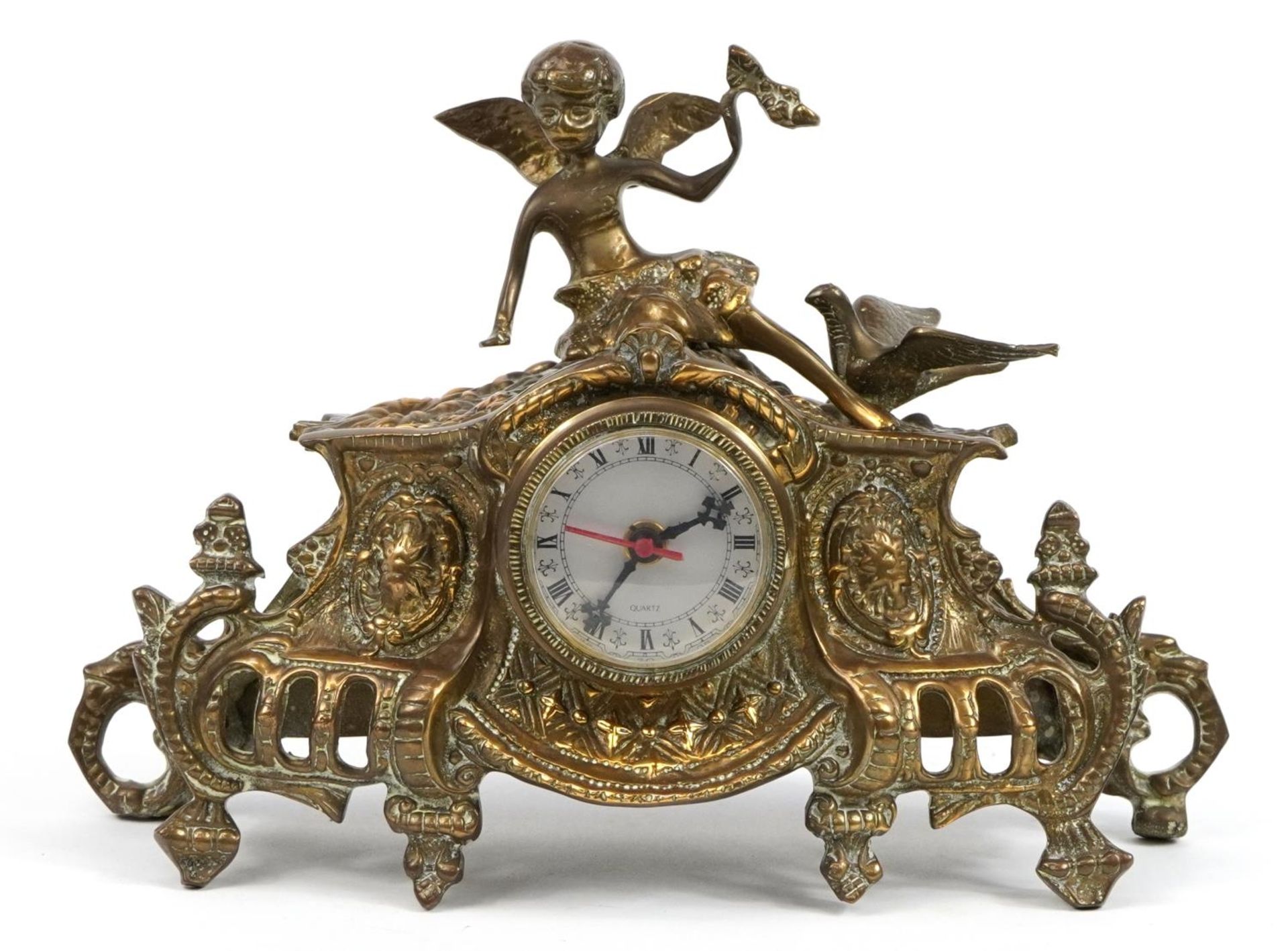 French design gilt brass mantle clock mounted with a winged figure and bird, 35cm wide
