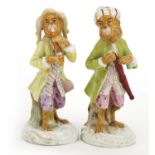 Two German hand painted porcelain monkey band musicians, the largest 13cm high