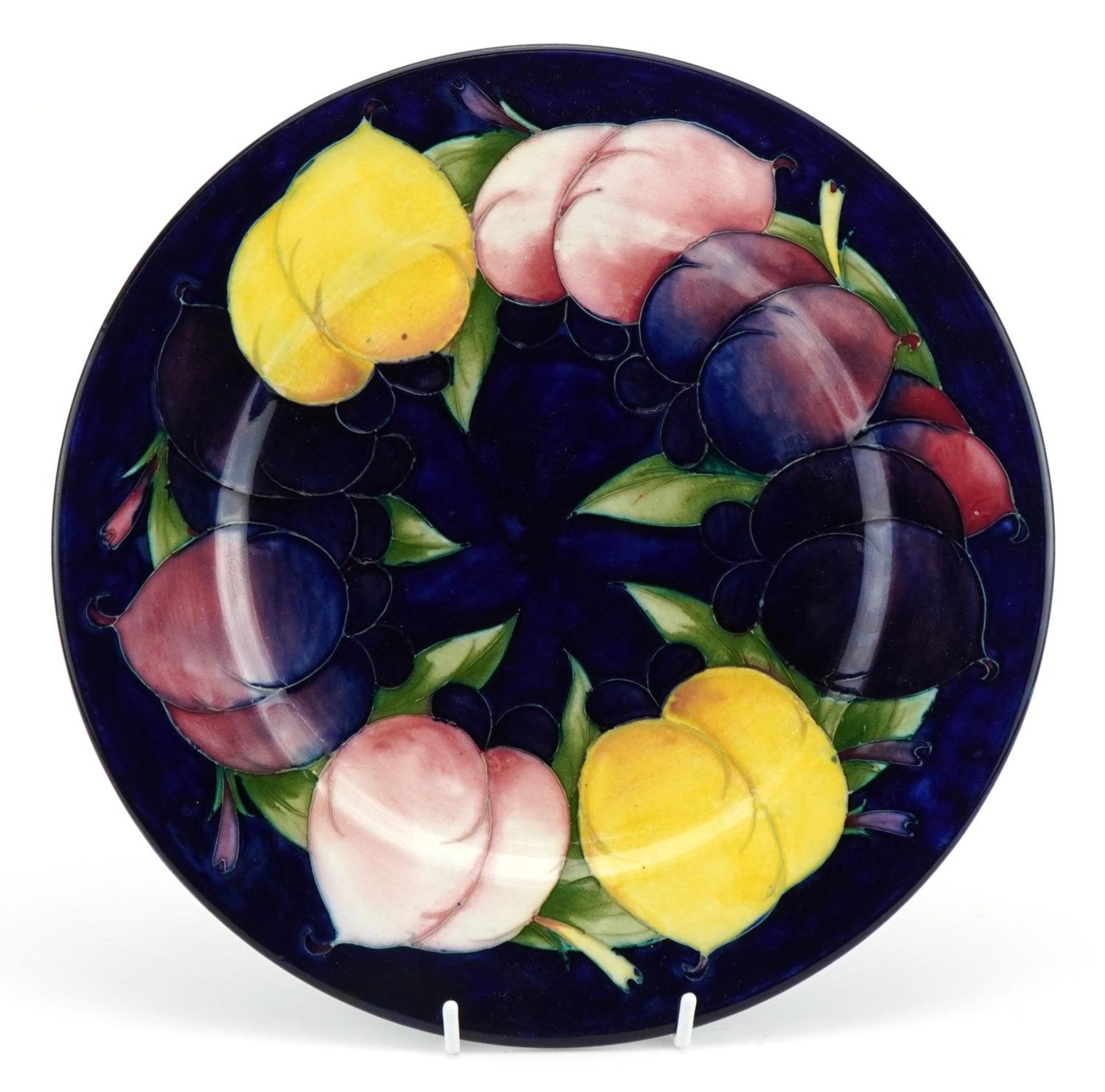 Moorcroft pottery plate hand painted with fruit, signed to the base, 29cm in diameter