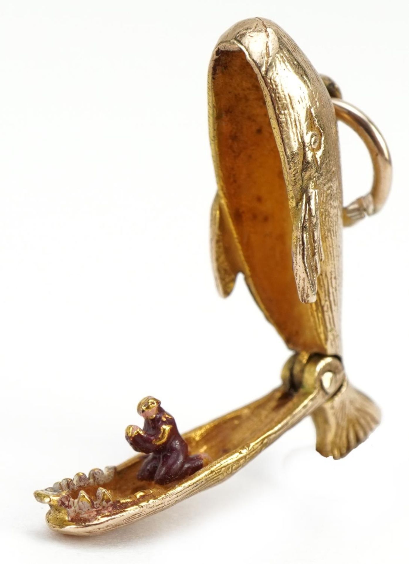 9ct gold whale charm with hinged mouth opening to reveal an enamelled figure, 2.3cm wide, 2.7g - Image 3 of 4