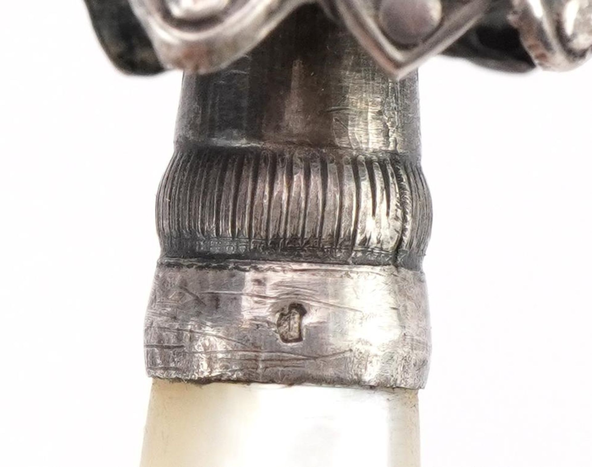 Silver baby's rattle with whistle and mother of pearl handle in the form of a gentleman in a robe, - Image 3 of 3