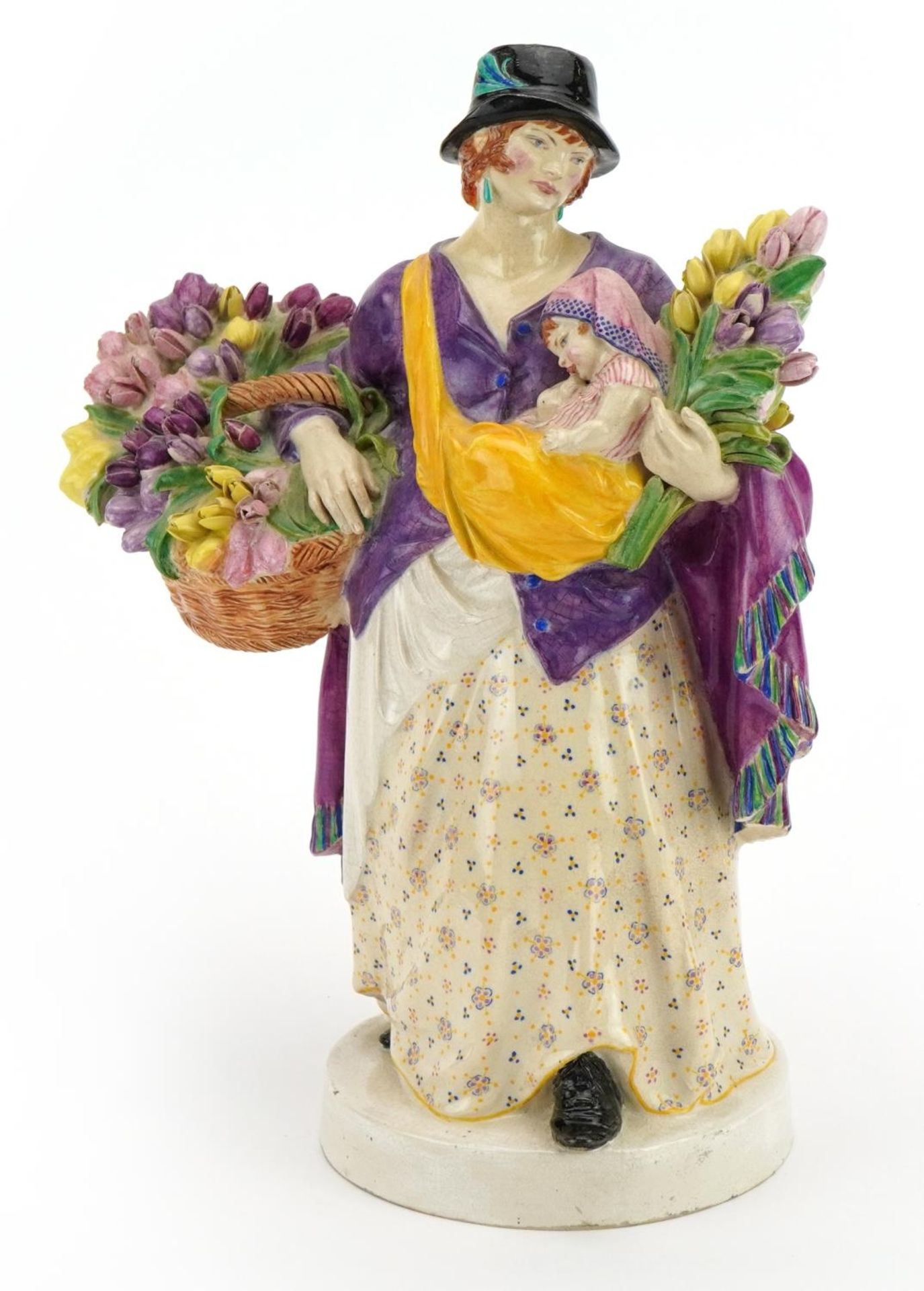 Charles Vyse, Chelsea Pottery figurine of a mother with child holding flowers, signed and dated 1921