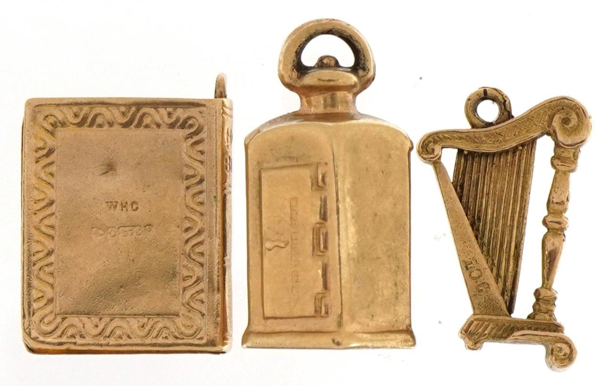 Three 9ct gold charms comprising bible, harp and lantern set with a green stone, the largest 1.9cm - Bild 2 aus 3